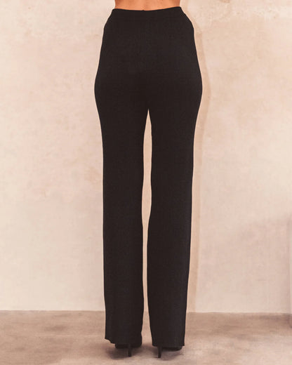 Elevate your style with our Carrie Knit Pants. The high-waisted design offers a flattering fit while the elasticated waistband provides maximum comfort. With a stylish flare leg, these pants are perfect for any occasion. Embrace effortless fashion in these must-have black pants.