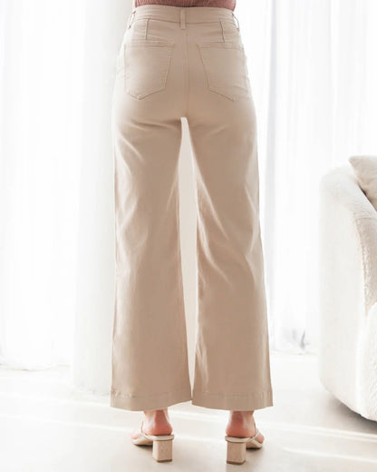 The Jenna Jeans in Beige offer a killer combo of comfort and coolness with their lightweight, stretchy and breathable fabric. These motion wide-leg jeans come with functional buttons and zipper front, high rise waist, and plenty of pockets for convenience. Style them with a plain white tee and oversized blazer for a timeless weekend look.