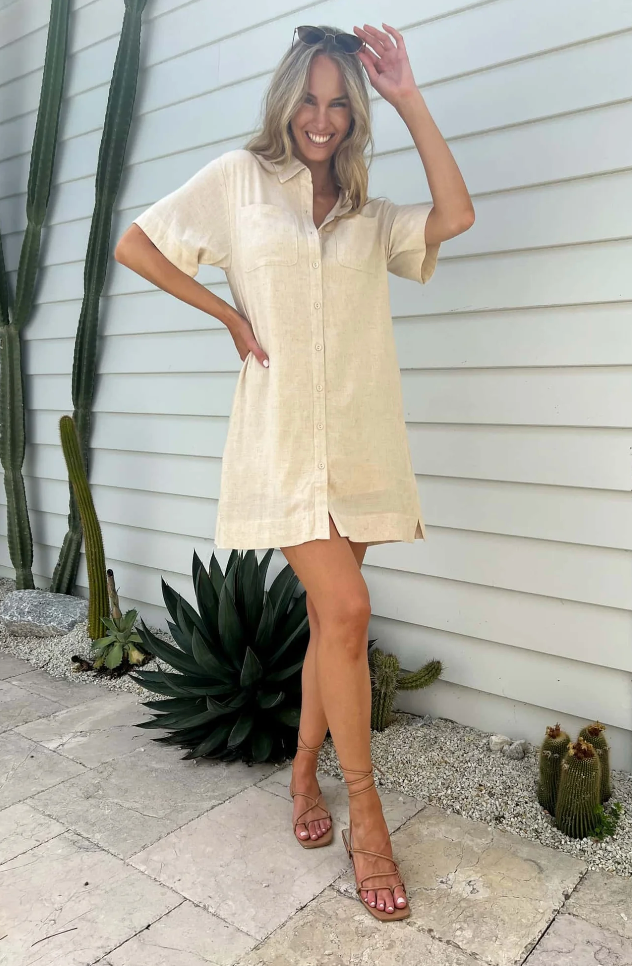 Dress to impress (yourself) in the Zahara Shirt Dress. This linen number features a shift shirt style with functional buttons and convenient pockets, perfect for any occasion. With a lined interior, it's as comfortable as it is stylish. You'll be strutting your stuff in no time!