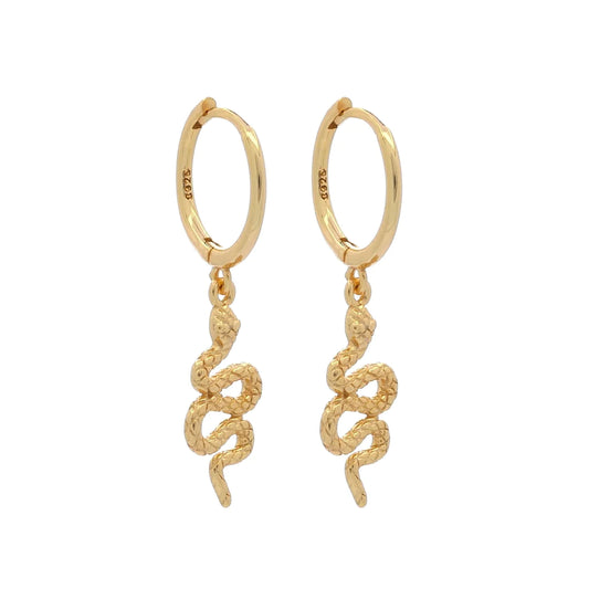 Experience luxury and comfort with Serpente Huggies Gold! These stylish earrings are perfect for sensitive skin, hypoallergenic and nickel-free for worry-free wear. Say goodbye to tarnishing, as these huggies are made to last and keep their shine. Elevate your style and make a statement with Serpente Huggies Gold.