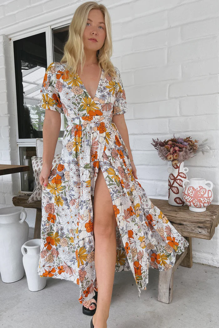 "Get ready to turn heads in the playful Maddi Wrap Dress featuring a daring V neckline, wrap around style, and tie up at the front for a flirty touch. Complete with cuff sleeves, this dress is perfect for any occasion!"