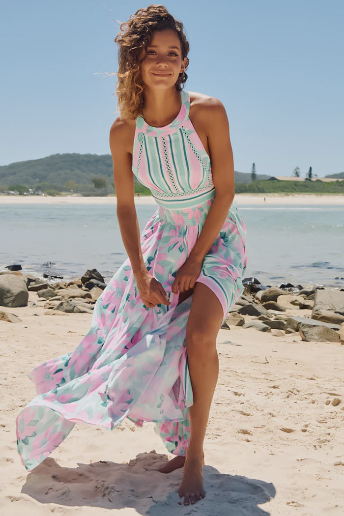 Show off your free spirit in this Endless Maxi Dress. Featuring an elastic ribbed waist, high neck, crochet detail, open back, thigh split, and tie up back - it's the ultimate summer maxi for a wanderlust getaway! Let your style do the talking.