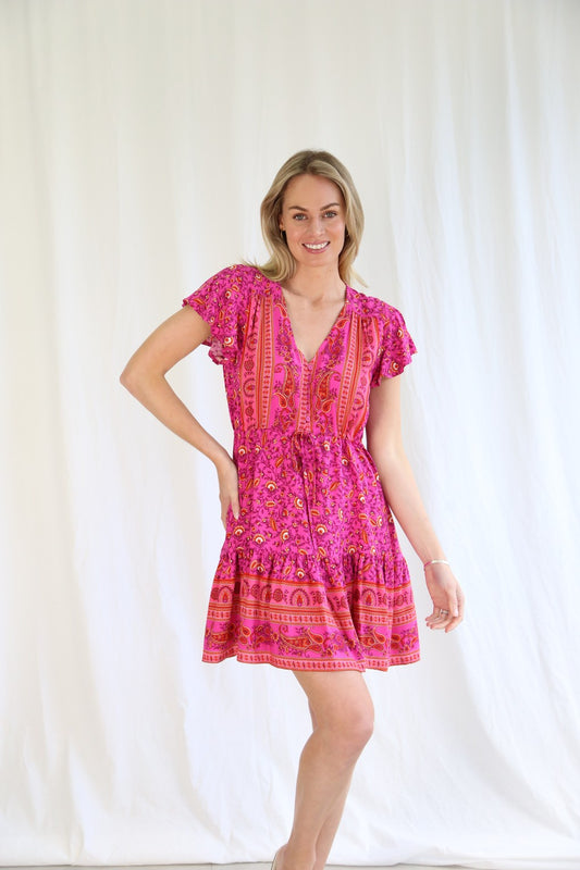 Introducing the Evie Mini Dress, the perfect combination of style and comfort. With its drawstring waist, this tiered style dress flatters any figure. The V neckline adds a touch of elegance, while the sleeves provide coverage. Upgrade your wardrobe with this playful and versatile dress!