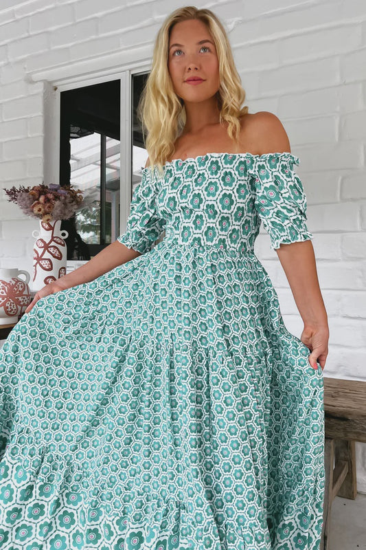 This Claudette Maxi Dress is the perfect balance of comfortable sophistication. The maxi length, off-the-shoulder design, and elastic cuffs make it an ultra-flattering must-have. Plus, the beautiful watermelon sugar print is sure to add a playful pop of color to any look!