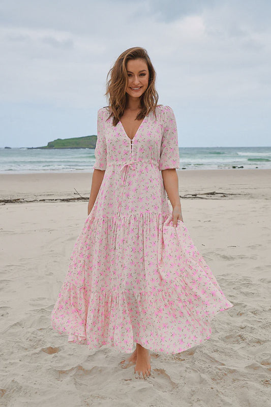 Be effortlessly stylish in the Tessa Maxi Dress - Amora Print. Featuring a V neckline, relaxed fit, and drawstring waist, this dress offers both comfort and style. The front split and button bodice add an extra touch of flair. Don't forget the 3/4 sleeves with elasticated cuff for a perfect fit.